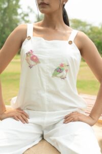 hand embroidered bird jumpsuit in white cotton – artisan luxury